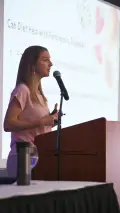 woman speaking podium